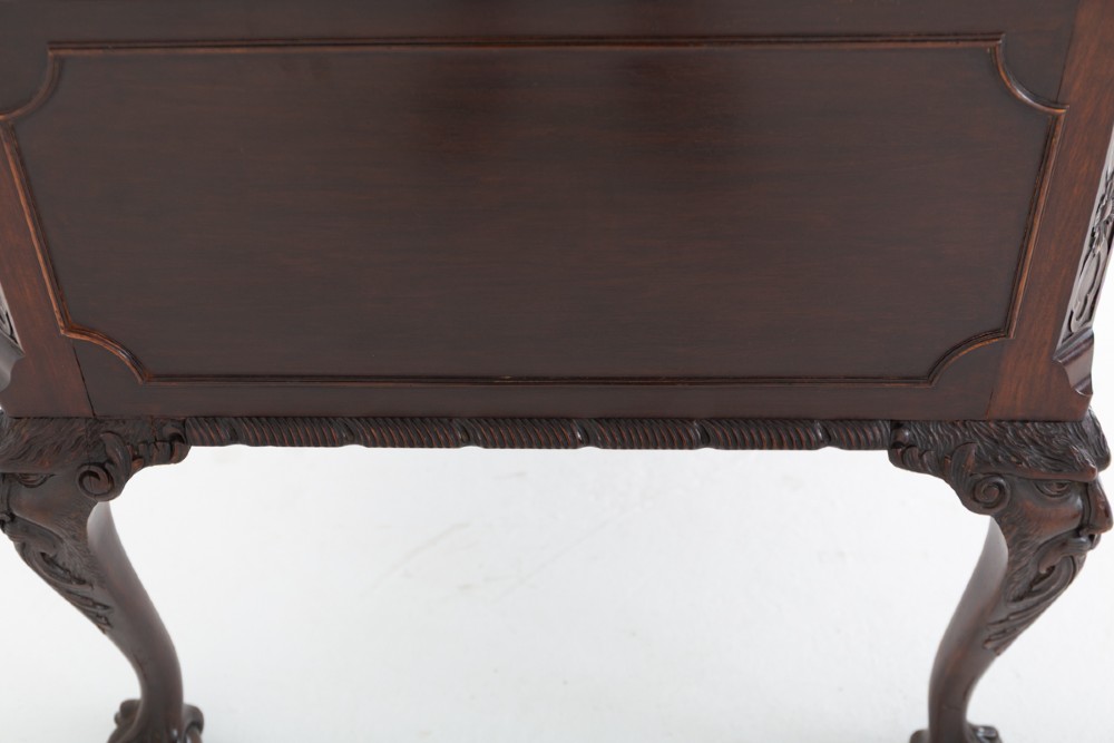 A dark mahogany Chippendale style writing desk featuring an inset leather top, carved cabriole legs with ball-and-claw feet, and brass drawer handles. View XIV