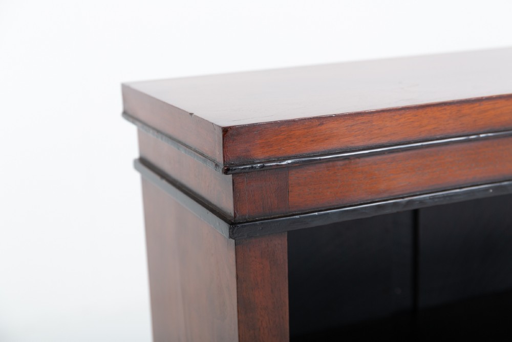 A Victorian mahogany open bookcase featuring open adjustable shelves, a dark interior, a upper moulded border, and a low plinth base. View IV