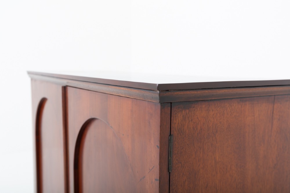 A Victorian mahogany side cabinet featuring two recessed arched panel doors and a solid plinth base. View II