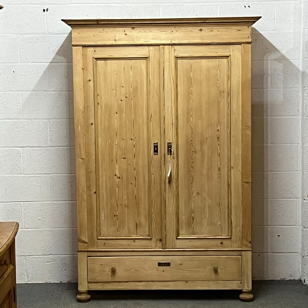 Tall Double Antique Pine Wardrobe With Bottom Drawer (Dismantles)