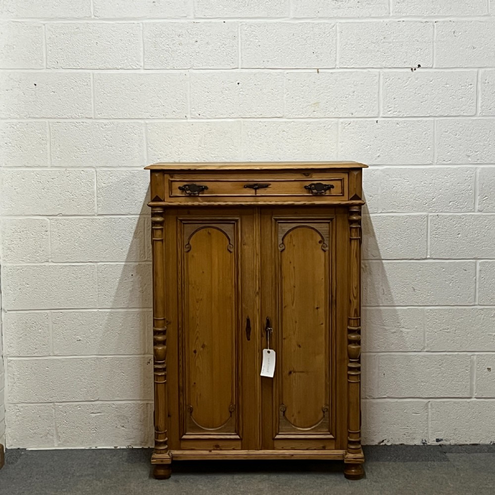 Tall Slim Waxed Pine 2 Door Cupboard With Top Drawer