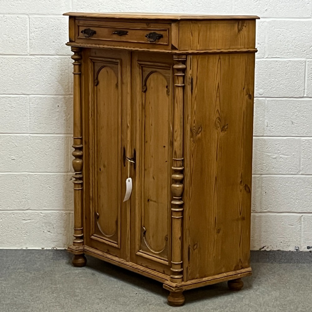 Tall Slim Waxed Pine 2 Door Cupboard With Top Drawer View IV