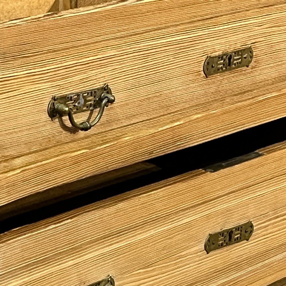 A tall antique stripped pine combination cupboard unit featuring a single long door, upper cabinet, open alcove, side drawers, and a base drawer. View XI