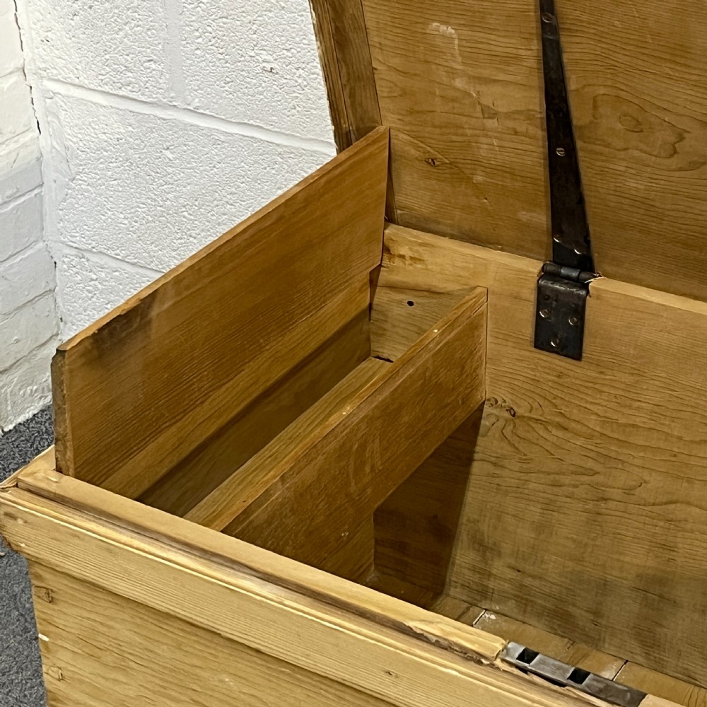 A large rectangular natural pine blanket chest featuring dovetailed joints, a hinged top lid, and a central keyhole escutcheon. View VI