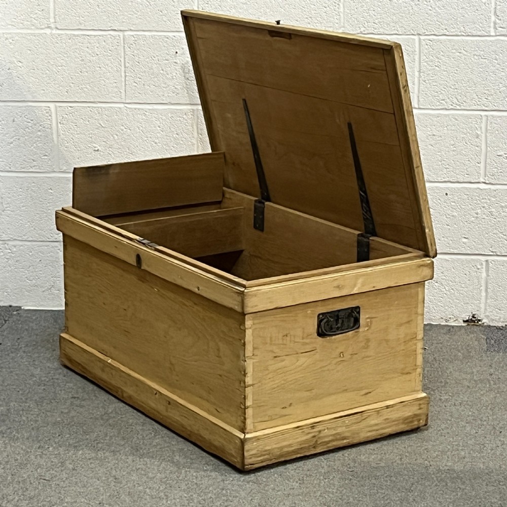 A large rectangular natural pine blanket chest featuring dovetailed joints, a hinged top lid, and a central keyhole escutcheon. View VII