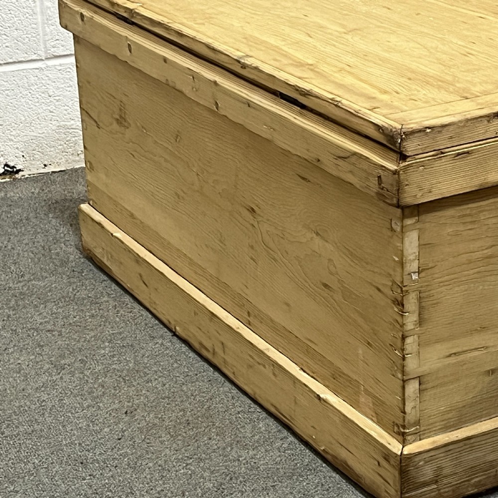 A large rectangular natural pine blanket chest featuring dovetailed joints, a hinged top lid, and a central keyhole escutcheon. View IX