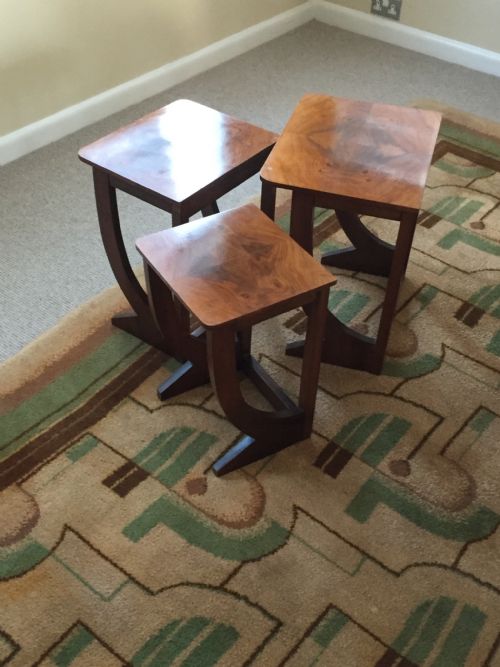 A Nest of Three Walnut Art Deco Side Tables.