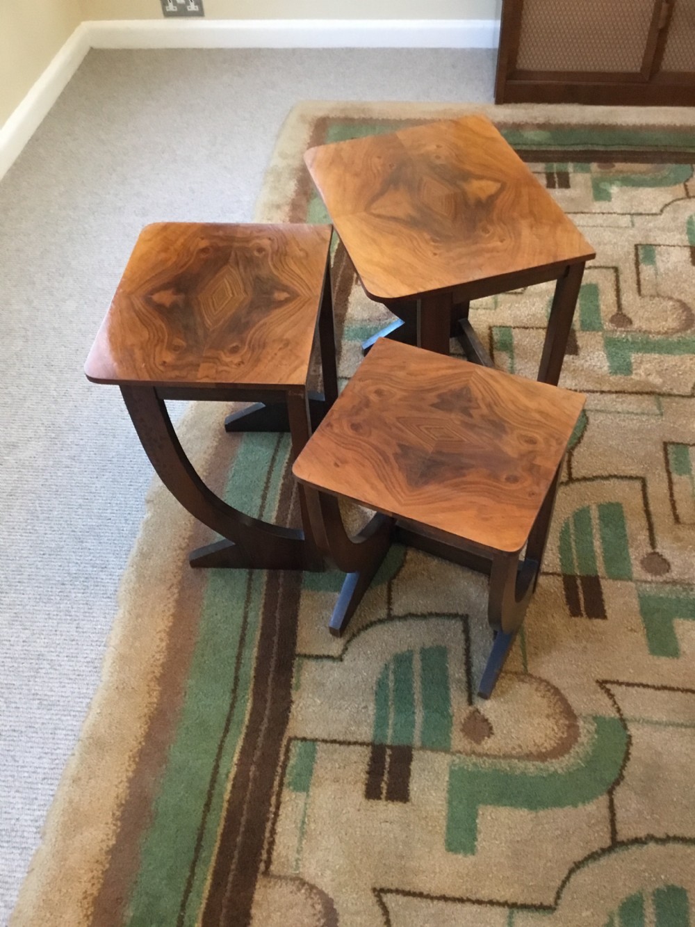 A nest of three Walnut Art Deco side tables. View III