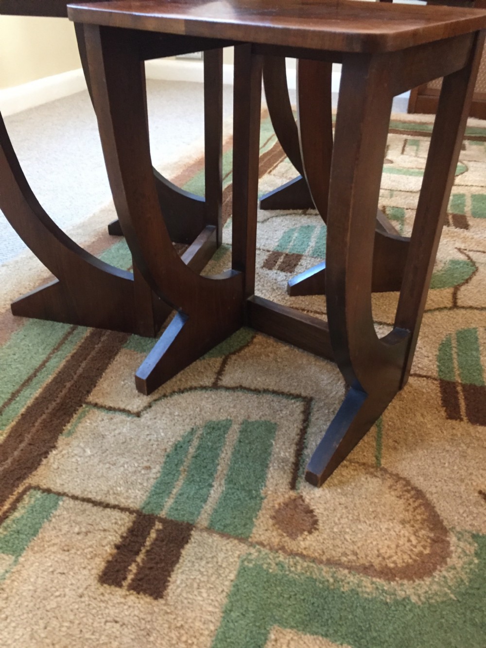 A nest of three Walnut Art Deco side tables. View IV
