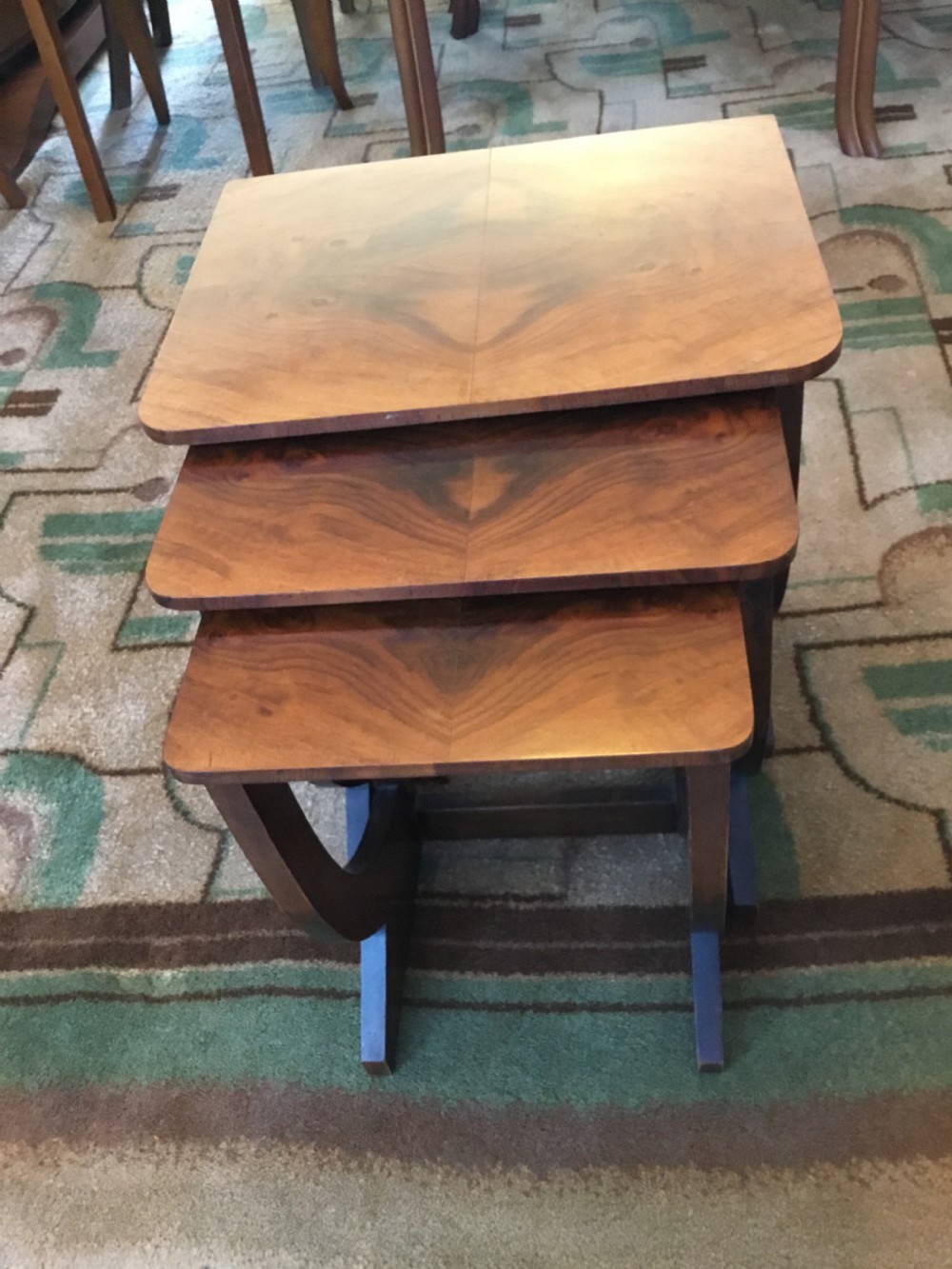A nest of three Walnut Art Deco side tables. View VII