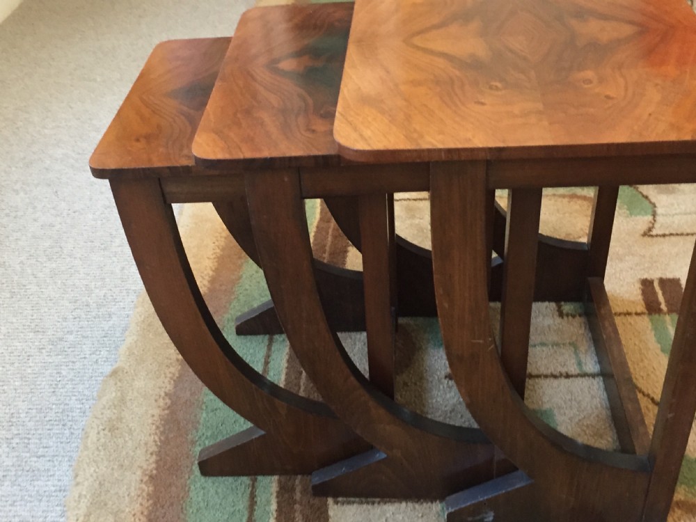A nest of three Walnut Art Deco side tables. View VIII