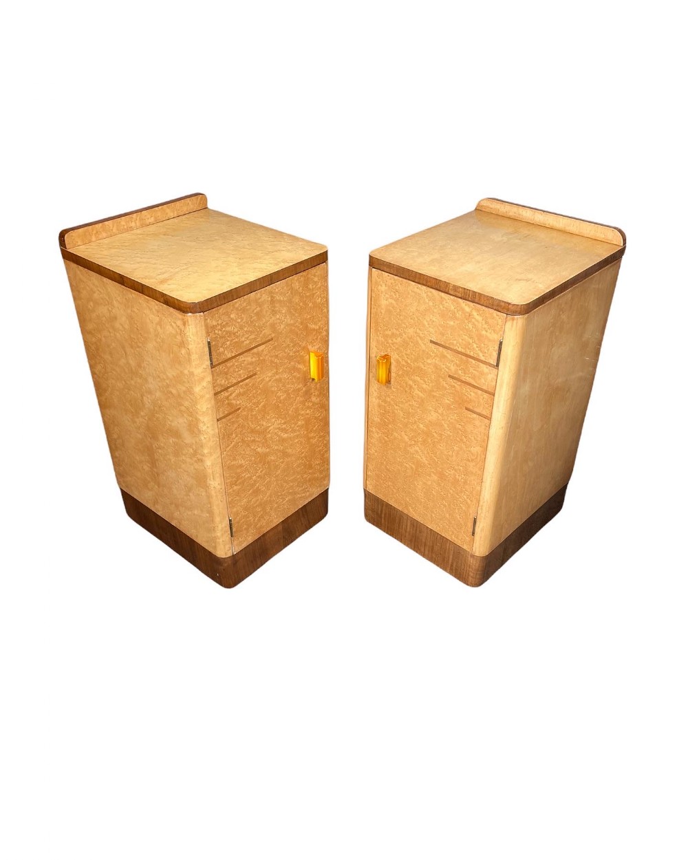A Pair of Art Deco Bedside Cabinets in the manner of H&L Epstein.