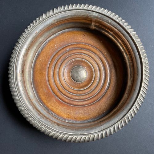 fig 4. A pair of antique Georgian Old Sheffield Plate wine coasters featuring gadrooned rims and turned wooden bases.