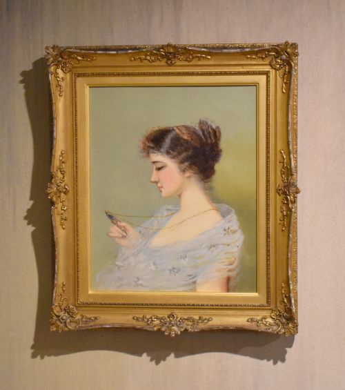 oil painting of a lady holding a miniature - CATEGORY: ANTIQUE ART - DATED 1930