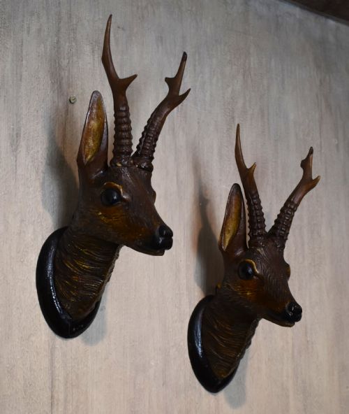 A Pair of Black Forest Carved Wood Deer Heads