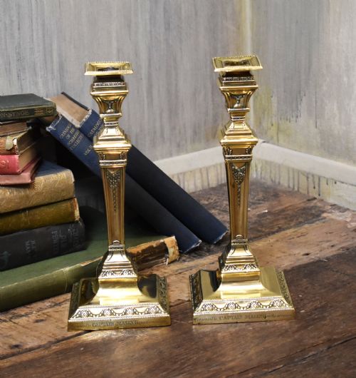 pair of military related brass candlesticks - CATEGORY: ANTIQUE LIGHTING - DATED 19TH CENTURY