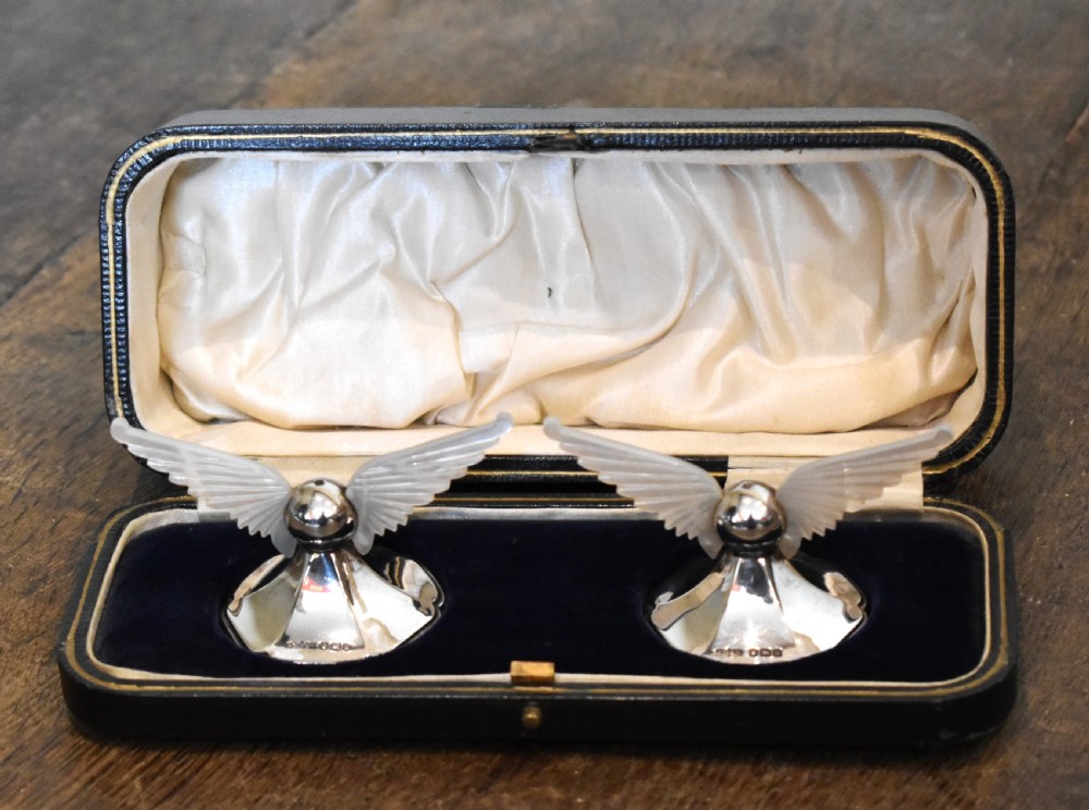 Unusual boxed pair of silver winged knife rests