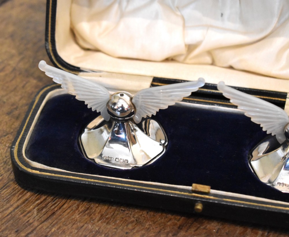 Unusual boxed pair of silver winged knife rests View II