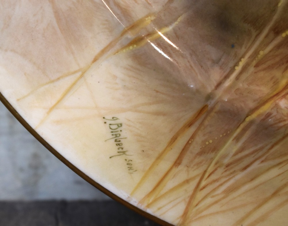 A circular porcelain cabinet plate with hand-painted trout amongst reeds and a gold gilded edge. View III