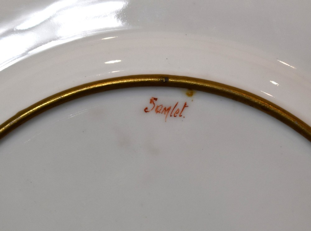 A circular porcelain cabinet plate with hand-painted trout amongst reeds and a gold gilded edge. View VI