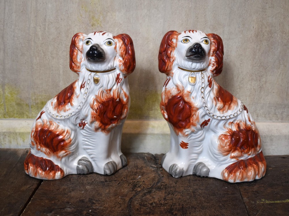 Fine pair of Victorian Staffordshire spaniel dogs