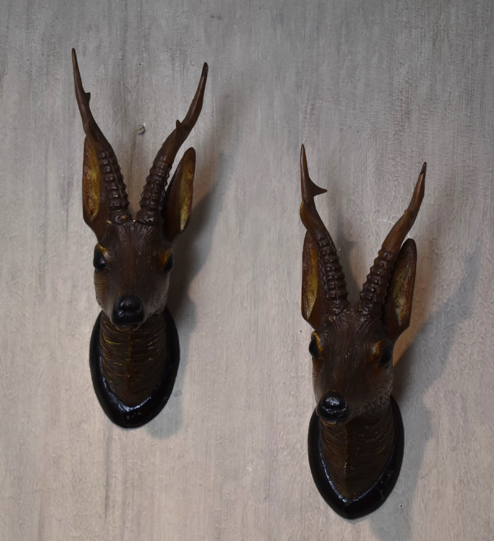 A pair of Black Forest carved wood deer heads View II