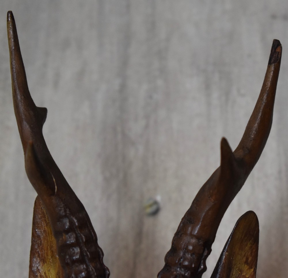 A pair of Black Forest carved wood deer heads View V