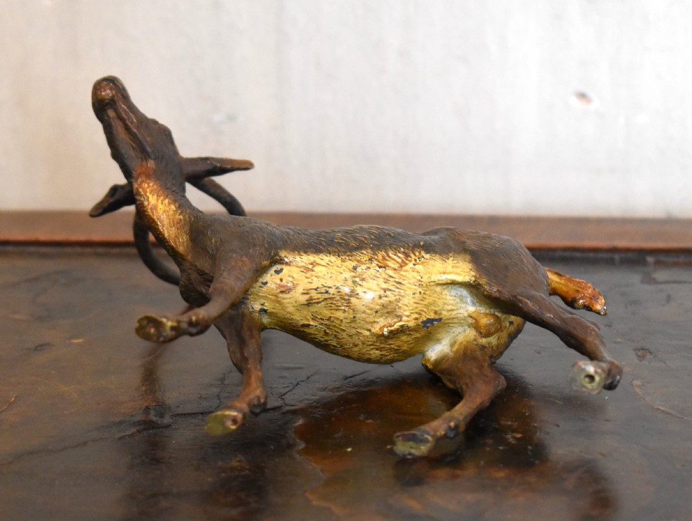 An Austrian cold-painted bronze figure depicting an antelope standing in profile with textured fur details and curved horns. View VI
