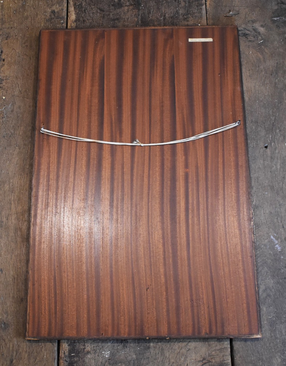 A rectangular honey-toned wood marquetry panel depicting a leaping salmon crafted from inlaid timber veneers. View IV