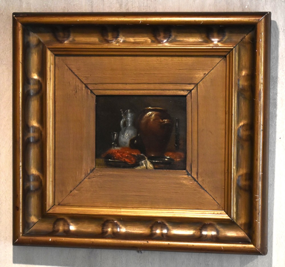 An 18th-century miniature oil painting depicting a dark still life composition with pottery and glass, housed within a wide gilt wood frame. View II