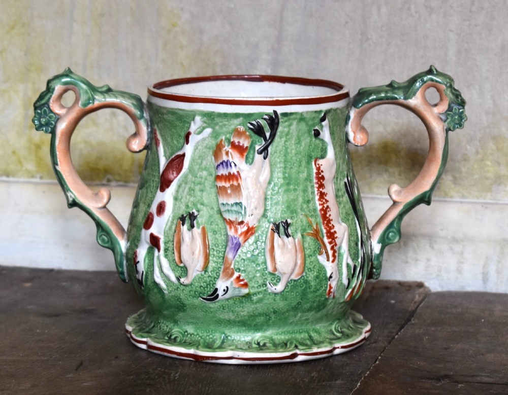 Unusual Staffordshire pottery loving cup