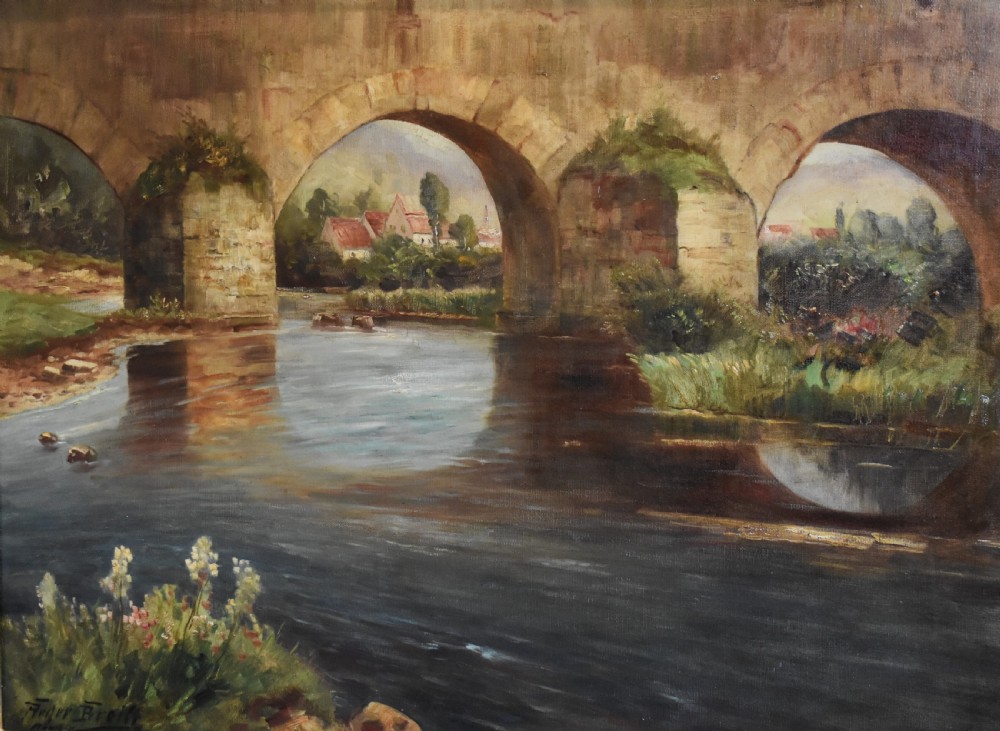 A framed oil painting featuring a large stone arch bridge over a river with reflections and a distant village. View V