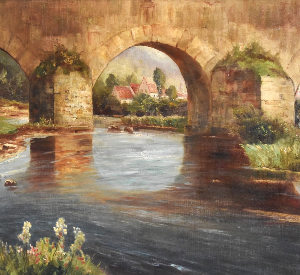 A framed oil painting featuring a large stone arch bridge over a river with reflections and a distant village. View VII