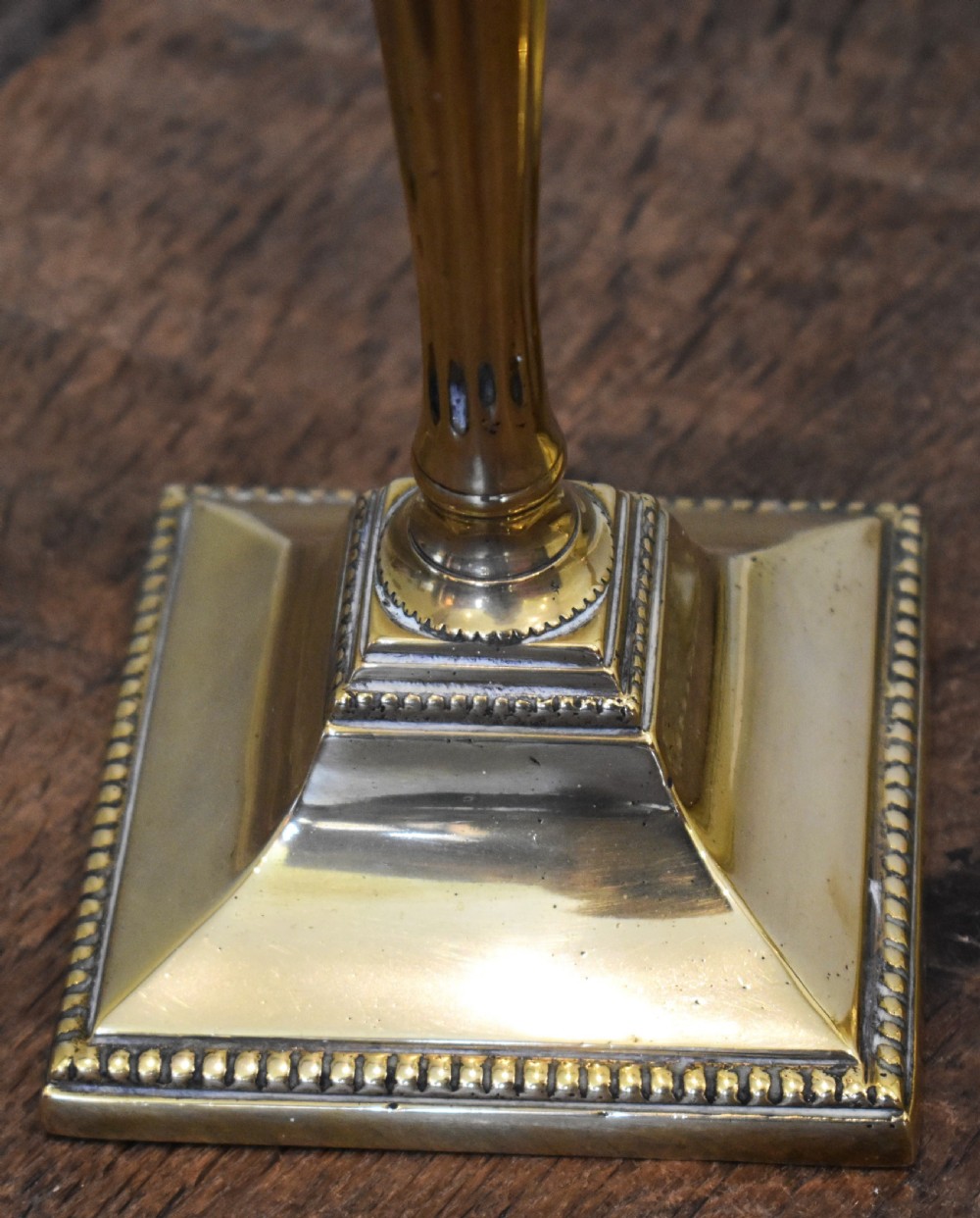 Fine pair of Georgian brass candlesticks View V