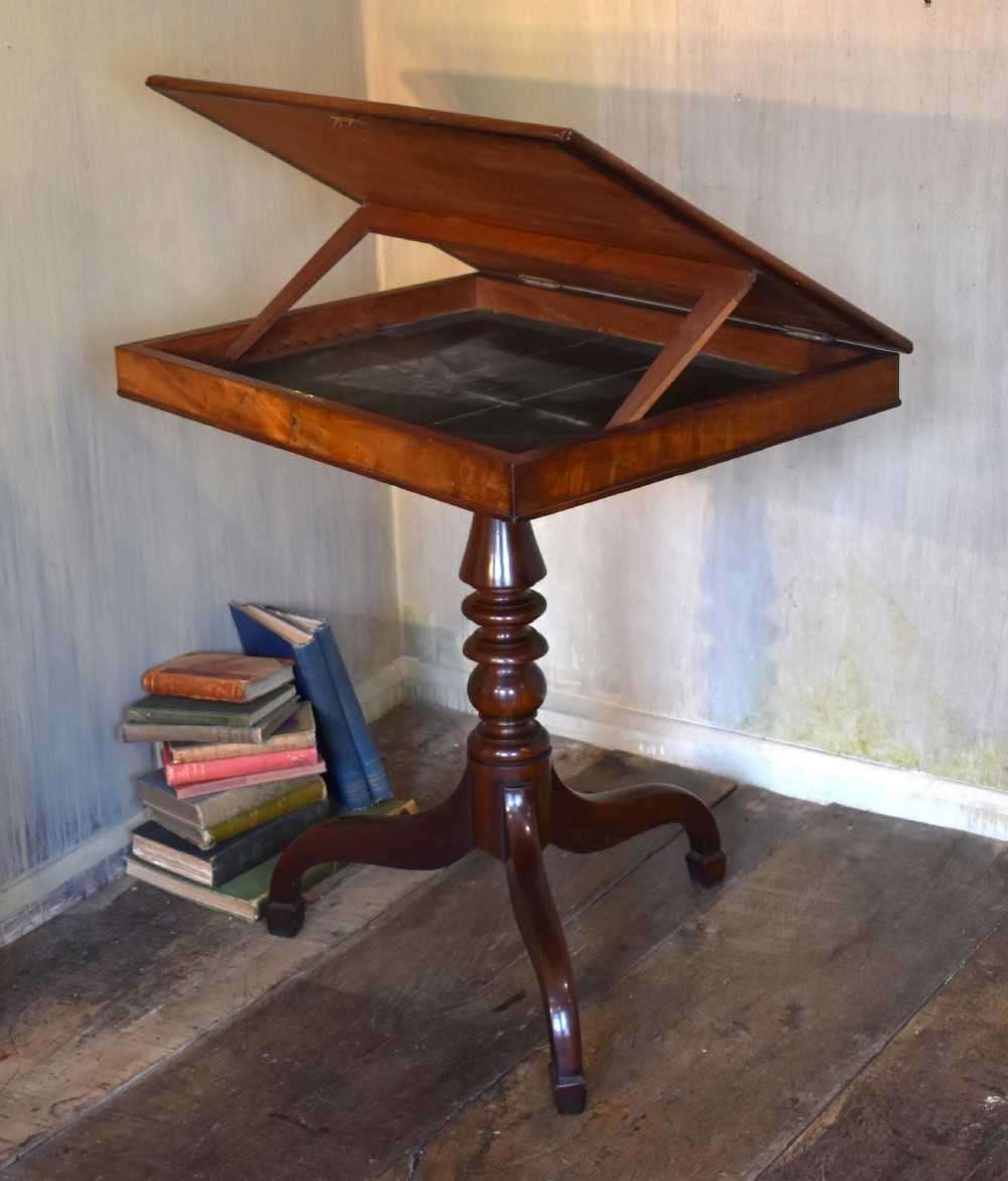 A Georgian mahogany library table featuring a rectangular leather-inset top supported by a turned pedestal stem and tripod swept legs. View III