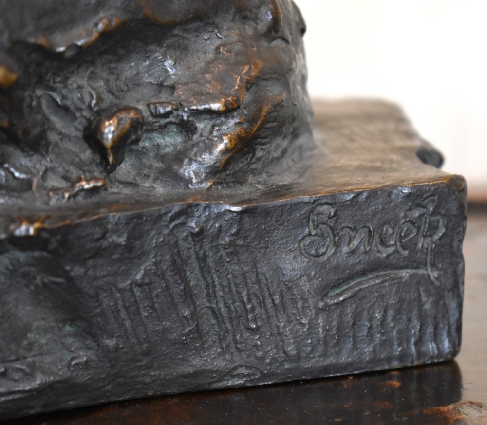 Fine bronze of a reclining dog View II