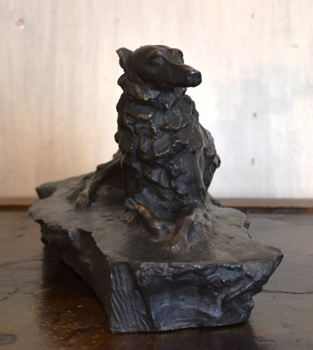Fine bronze of a reclining dog View III