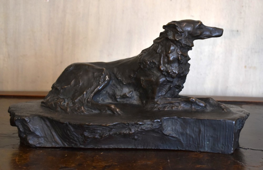 Fine bronze of a reclining dog View IV