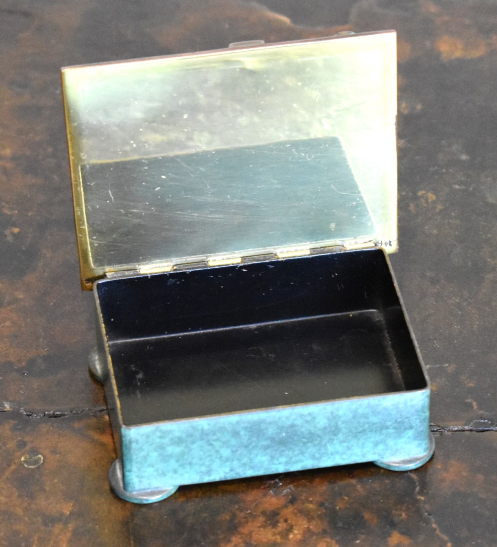 An Austrian Art Deco rectangular bronze box featuring a patinated verdigris green finish and lid adorned with raised circular copper studs. View II