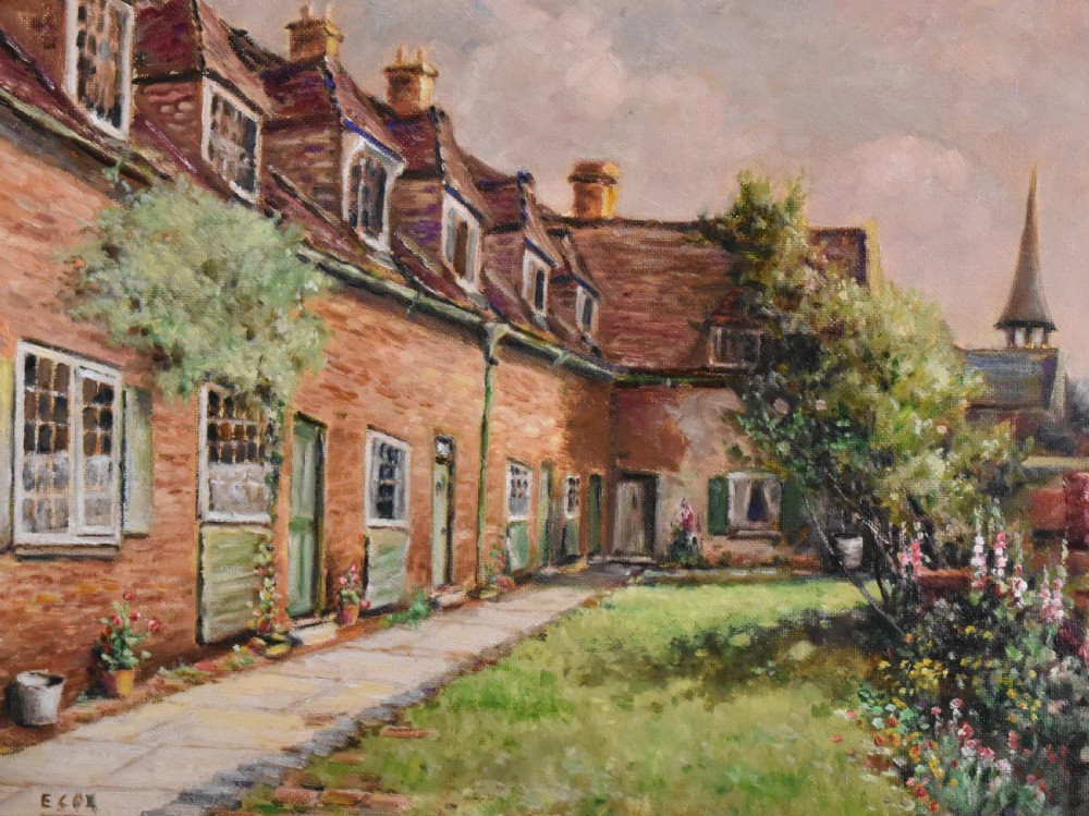 A framed oil painting depicting a row of brick cottages with green shutters alongside a garden path, enclosed in an ornate gilded frame. View V