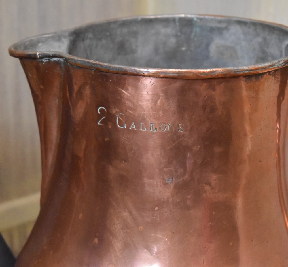 A large Georgian hand-hammered copper jug featuring a rounded baluster body, shaped pouring spout, heavy looped handle, and tin-lined interior. View VI