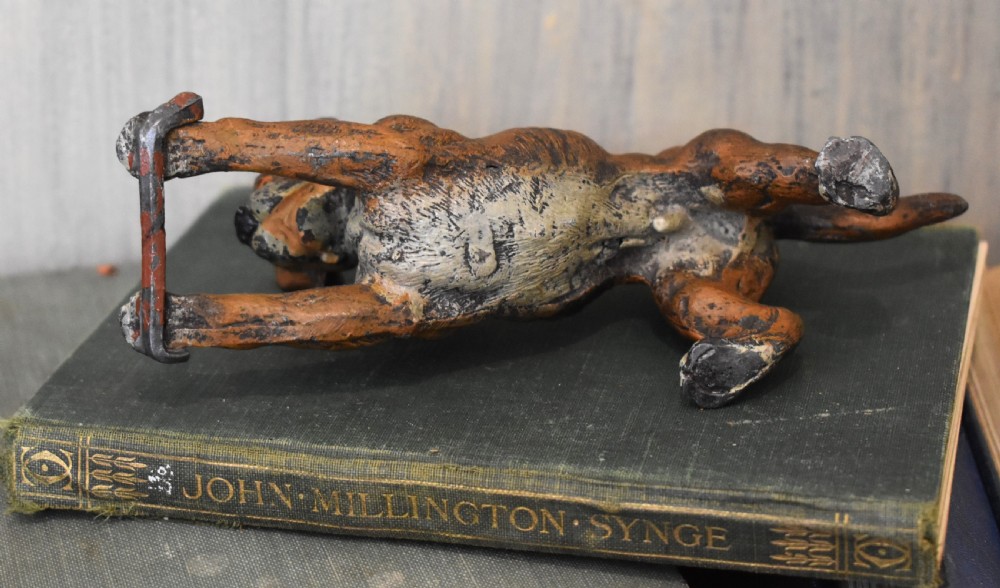 A cold painted spelter figurine depicting a dog in a playful stretching pose with an articulated nodding head mechanism. View IV