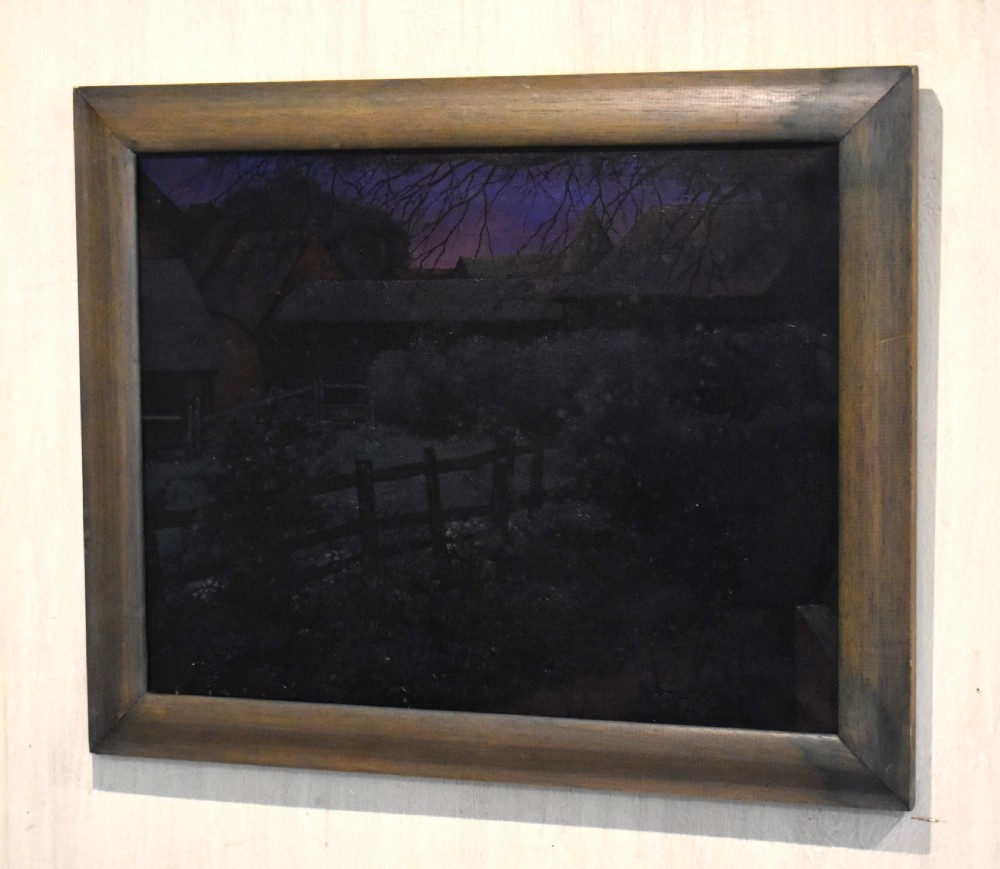 A framed oil painting depicting a nocturnal countryside scene under a purple twilight sky with silhouette trees and a timber fence.