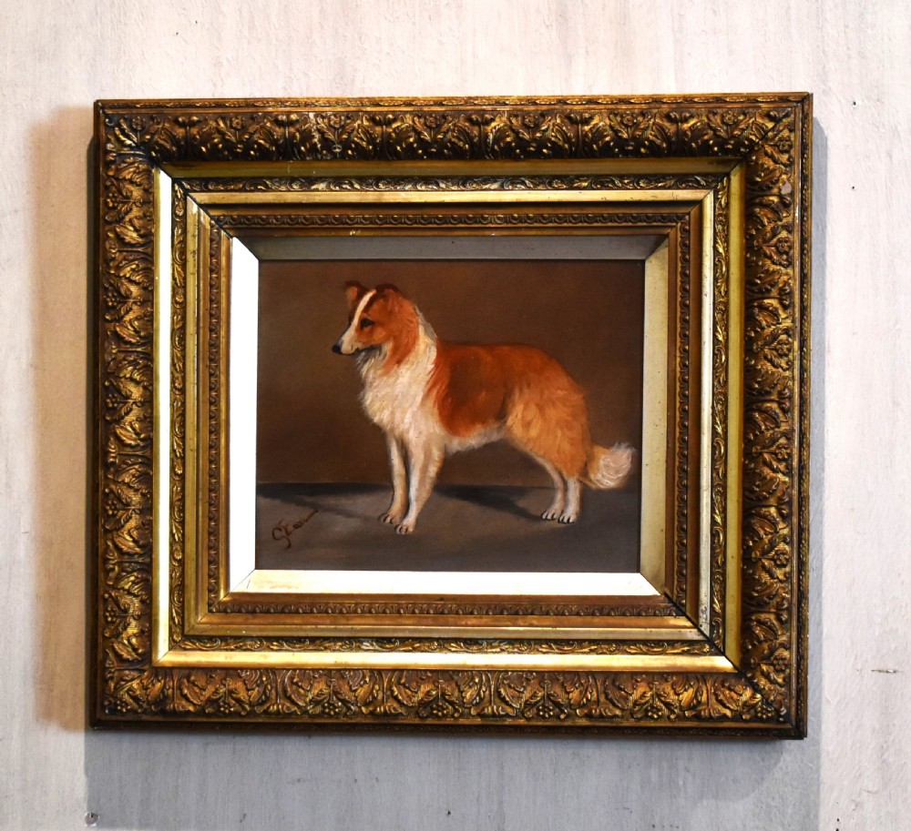An oil painting of a sable and white Rough Collie standing in profile, set within an ornate gilded wood frame.