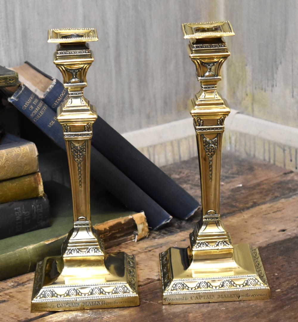 Pair of military related brass candlesticks View II