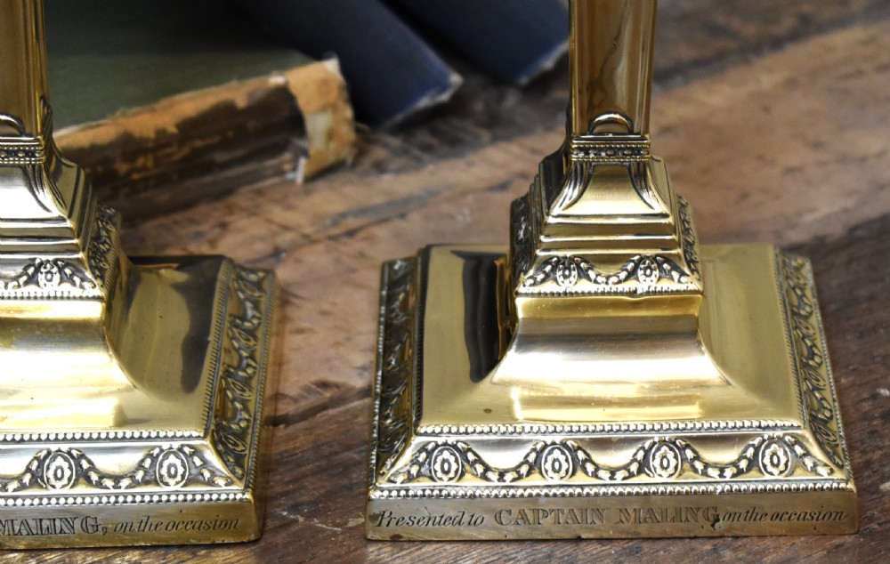Pair of military related brass candlesticks View III