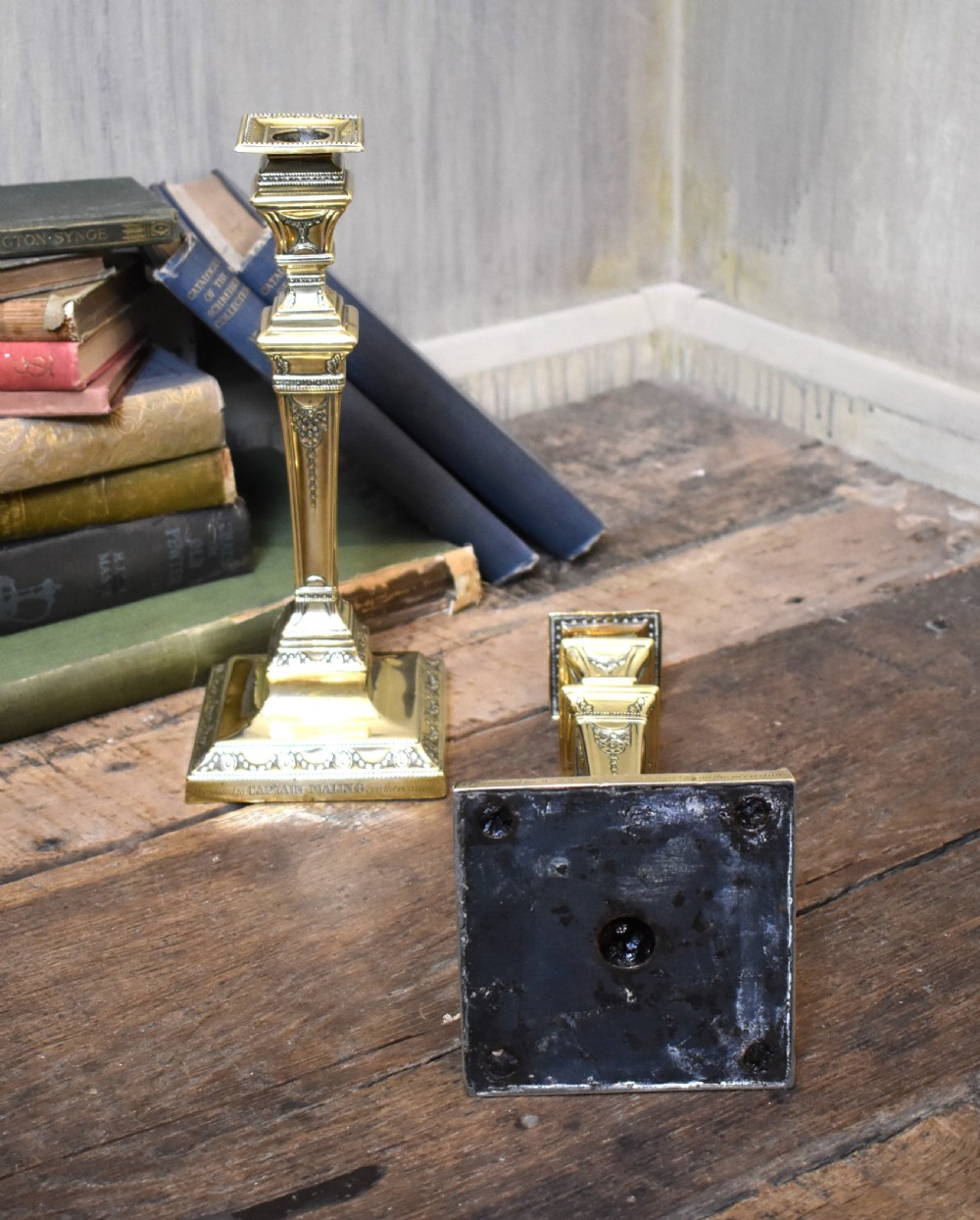 Pair of military related brass candlesticks View V