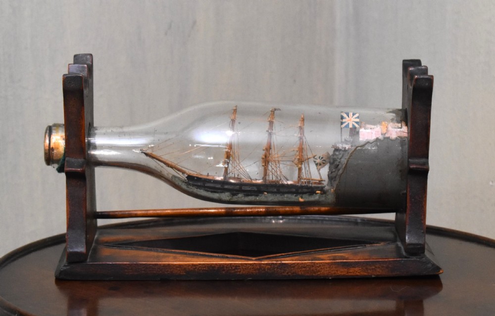 Ship in a bottle on stand