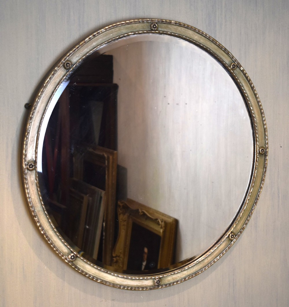 Silvered circular mirror