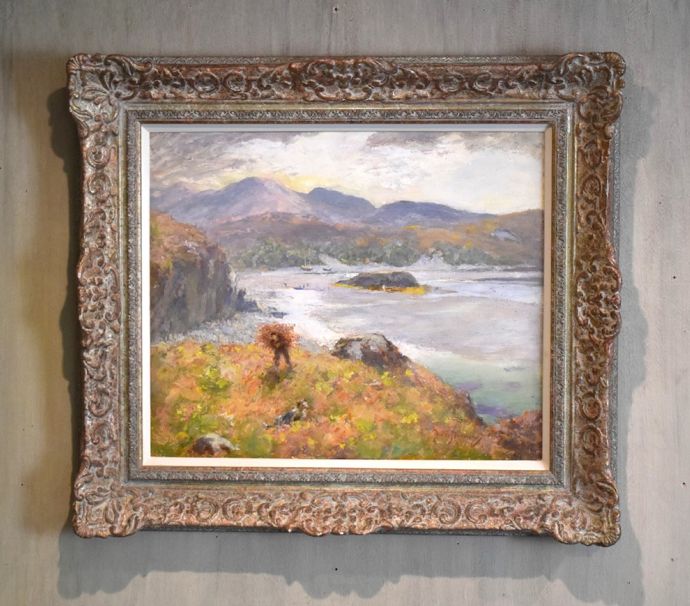 An impressionistic oil painting depicting a coastal landscape with distant mountains, framed in a carved metallic gilded frame.